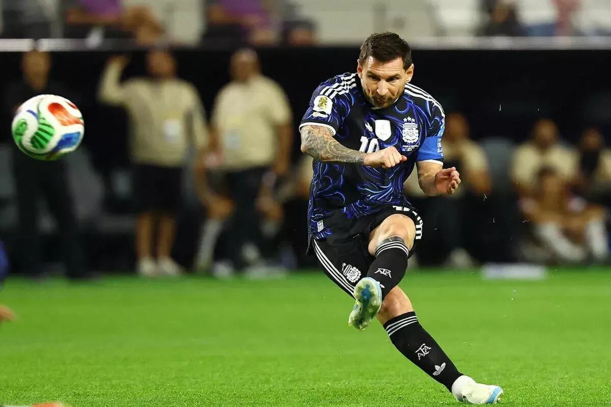 Argentina's Lionel Messi shoots at goal from a free kick