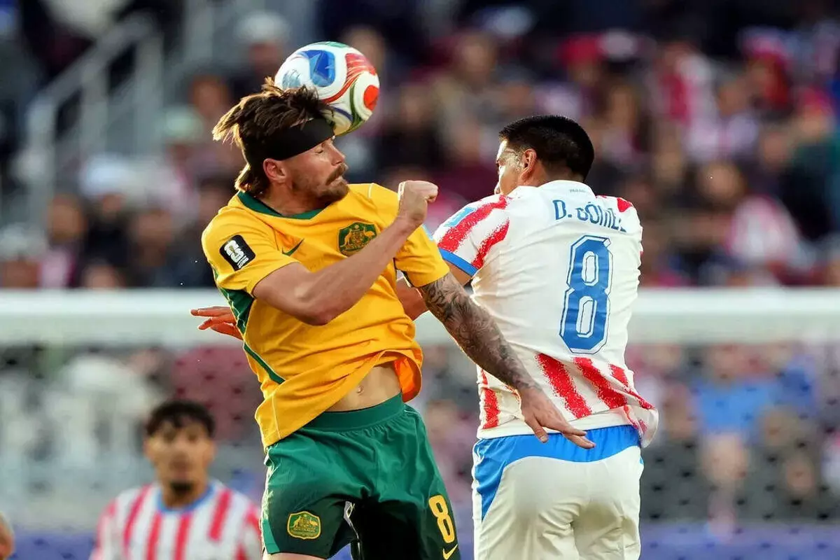 Australia's Connor Metcalfe in action with Paraguay's Diego Gome