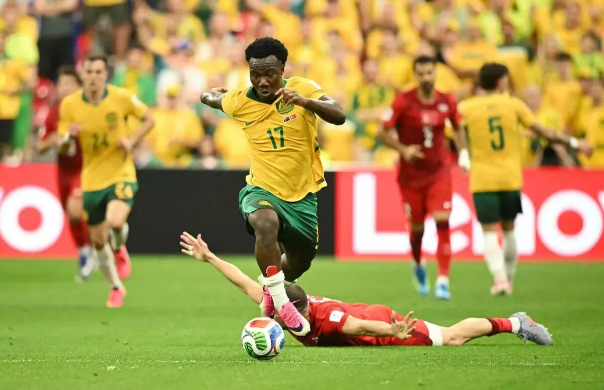 Australia's Nestory Irankunda runs past Turkiye's defenders