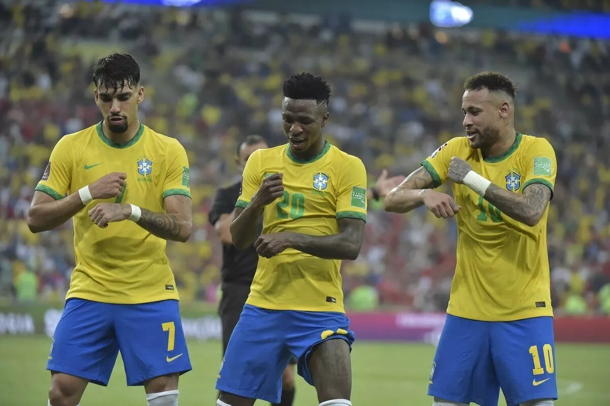 Brazilian players celebrate goal during Chile match