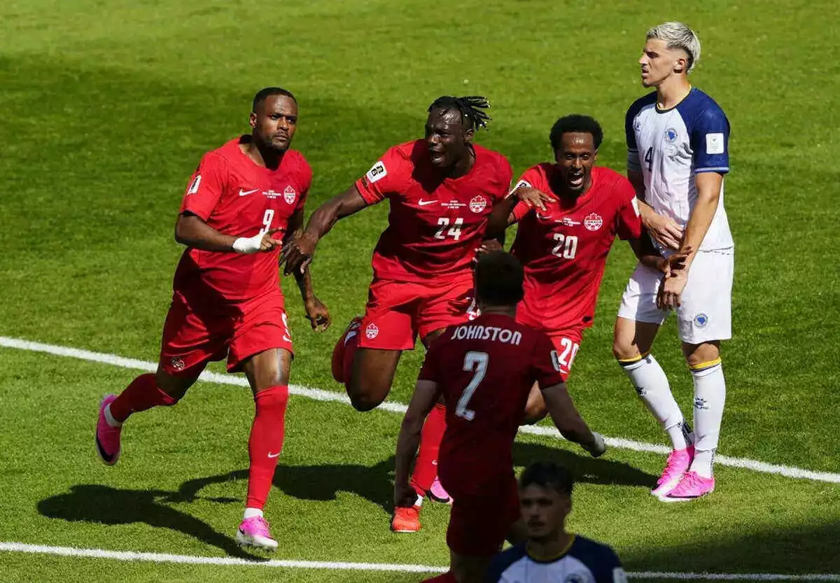 Canada's Cyle Larin celebrates scoring their first goal vs Bosnia and Herzegovina