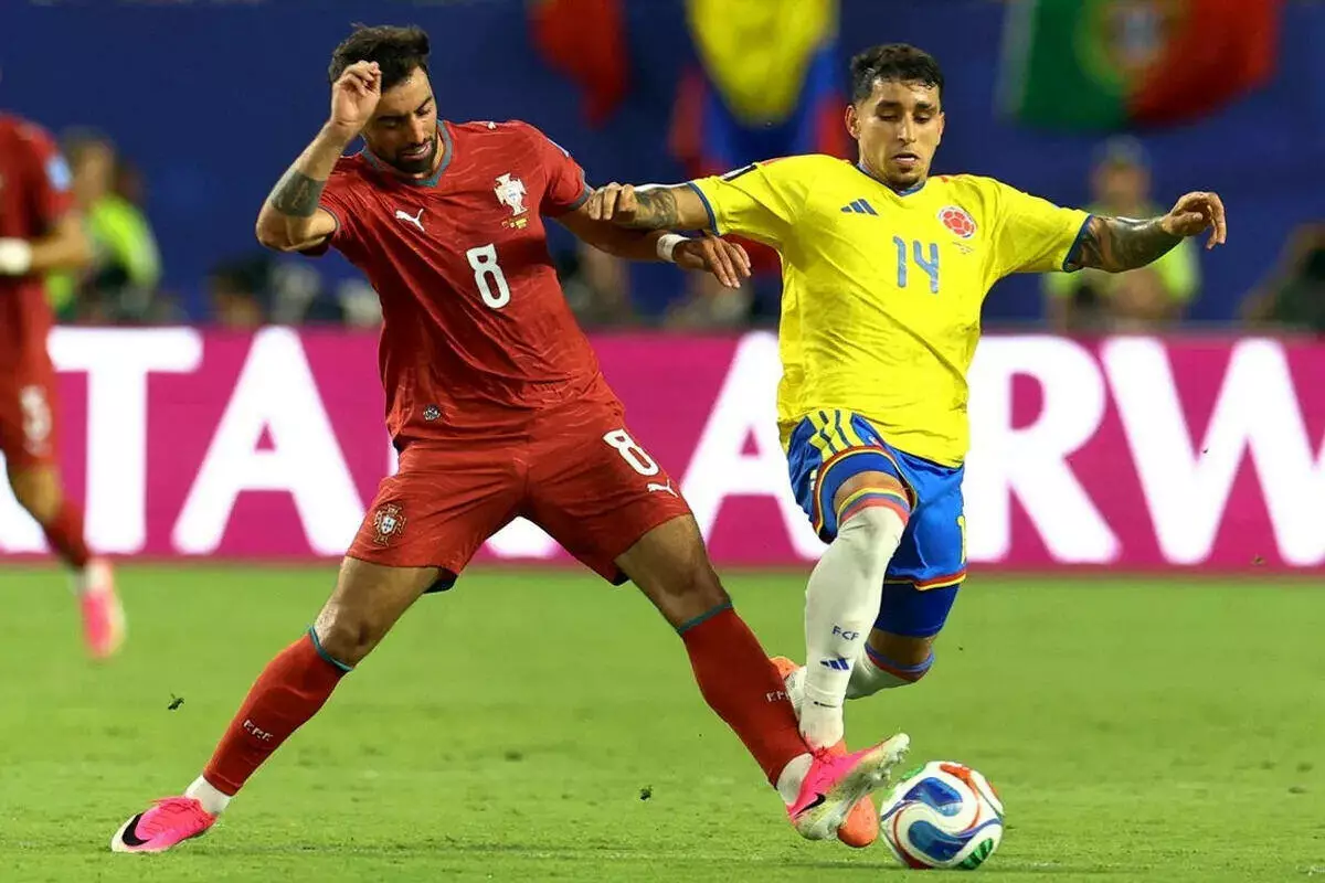 Colombia's Gustavo Puerta in action with Portugal's Bruno Fernandes