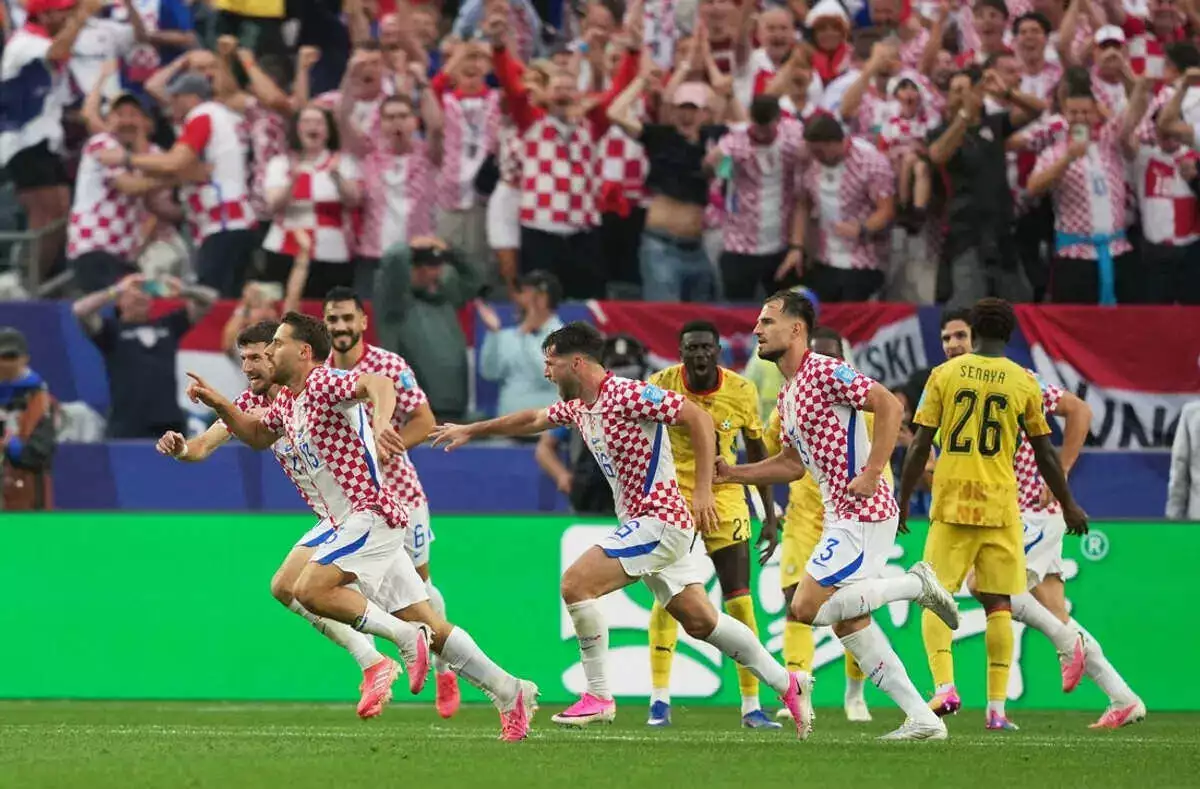 Croatia's Nikola Vlasic celebrates scoring their second goal vs Ghana with teammates