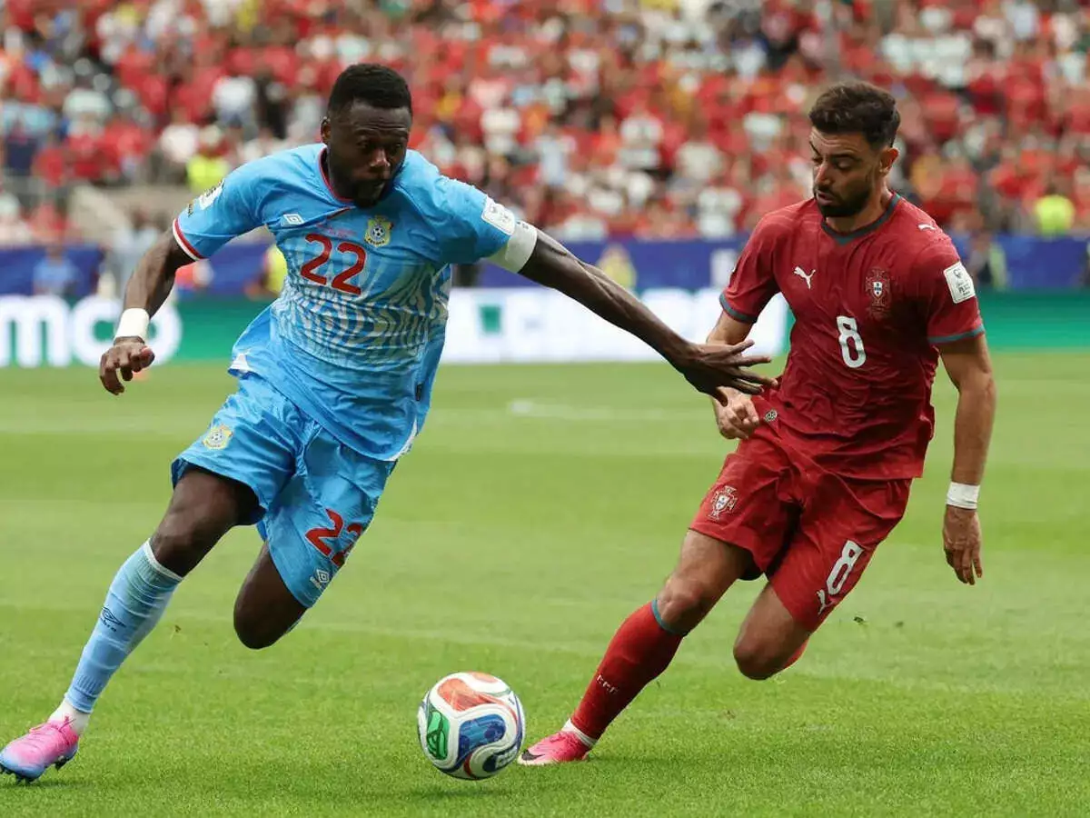 DR Congo's Chancel Mbemba in action with Portugal's Bruno Fernandes