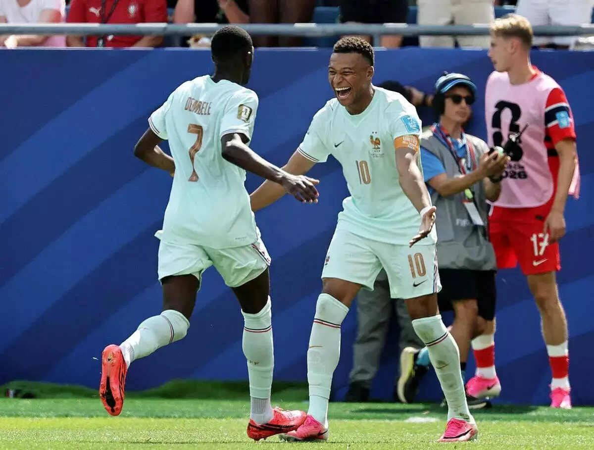 France's Ousmane Dembele celebrates with Kylian Mbappe after scoring their third goal to complete a hat-trick
