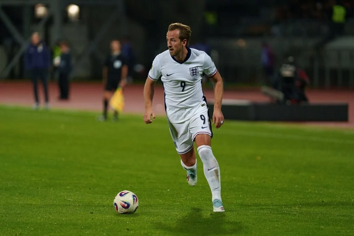 Striker Harry Kane looks to pass the ball for England