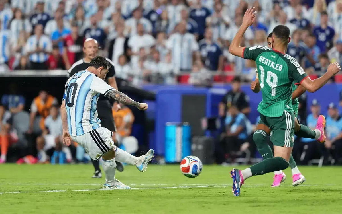 Argentina's Lionel Messi scores their third goal to complete a hat-trick.