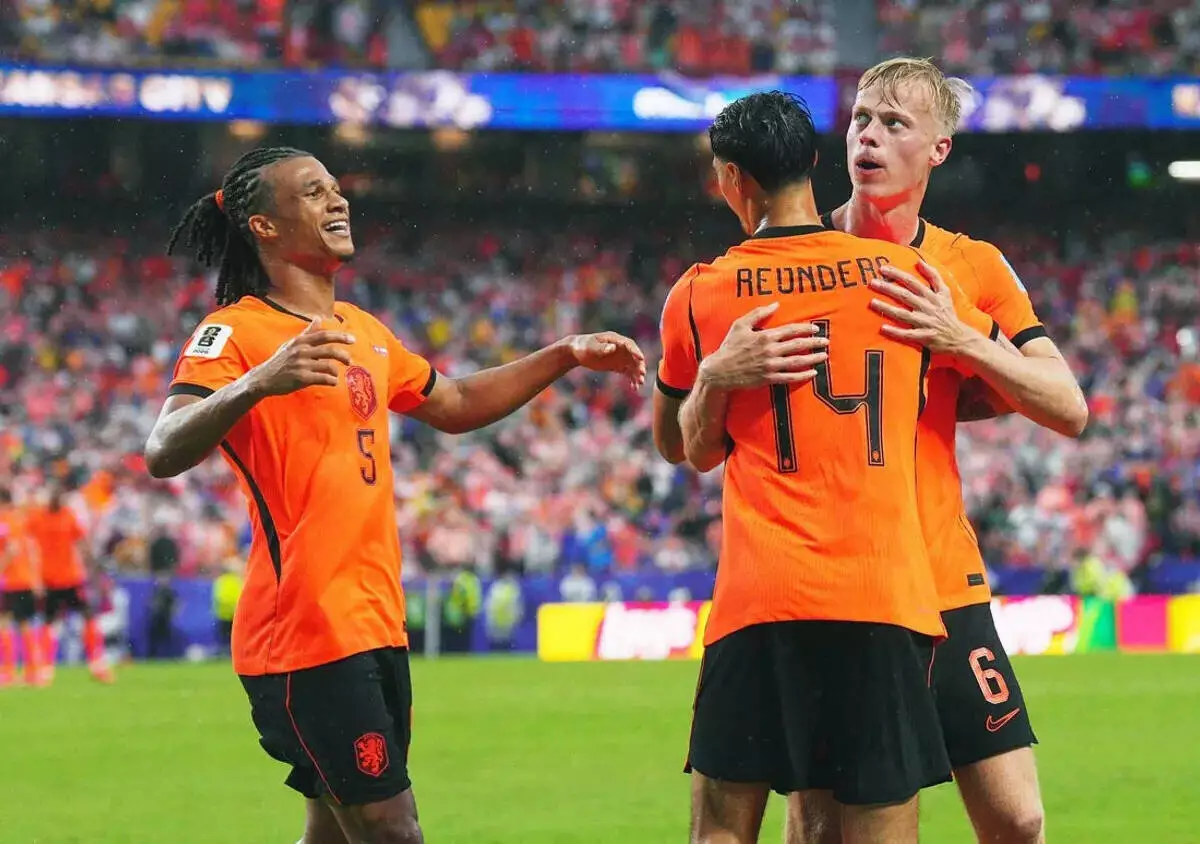 Netherlands' Jan Paul van Hecke celebrates scoring their third goal with Tijjani Reijnders and Nathan Ake