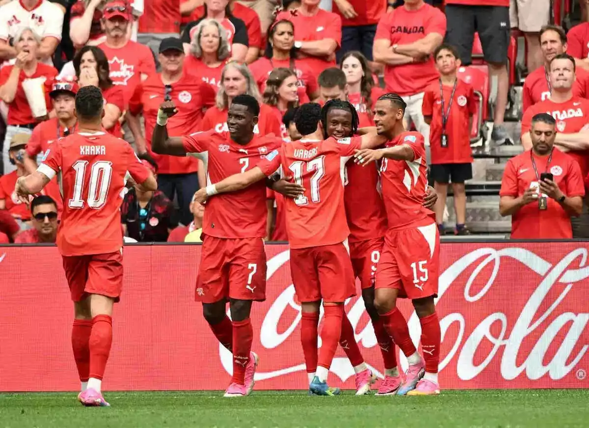 Switzerland celebrates scoring against Canada
