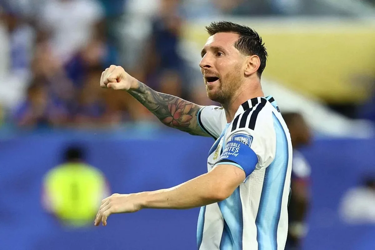 Argentina's Lionel Messi celebrates after Lisandro Martinez scores their second goal