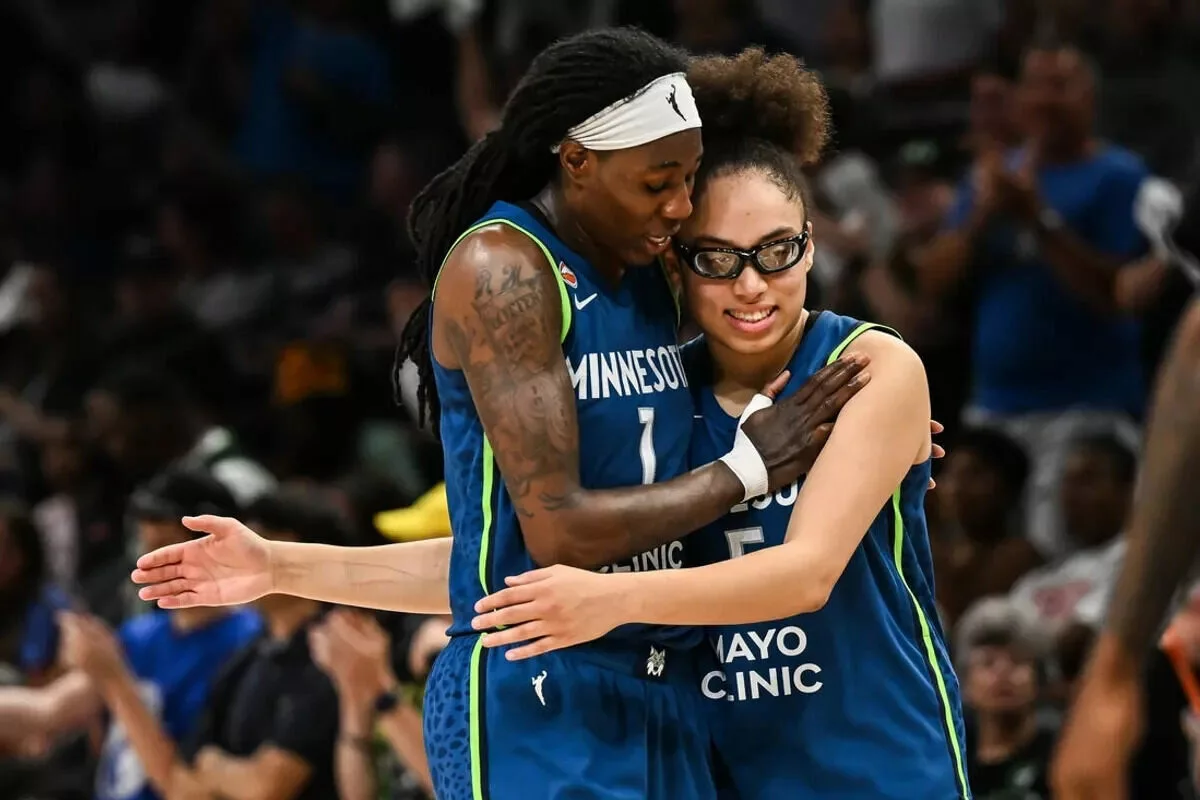 Minnesota Lynx forward Natasha Howard and guard Olivia Miles