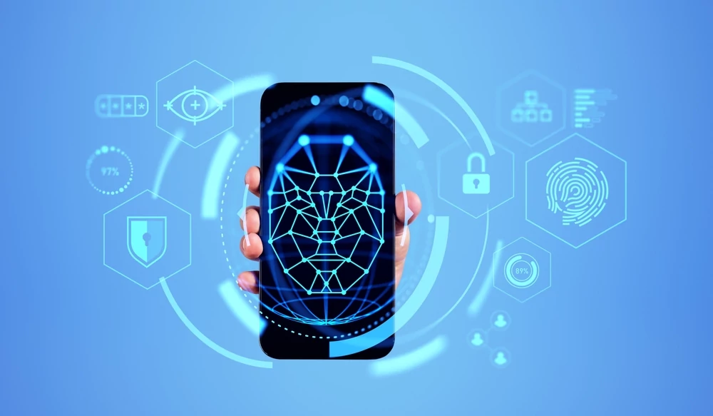 Hand,Of,Man,Showing,Smartphone,With,Immersive,Facial,Recognition,Interface