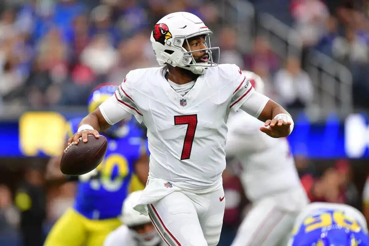 Arizona Cardinals quarterback Jacoby Brissett looks to throw downfield against the Los Angeles Rams