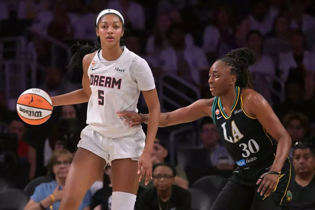 Atlanta Dream forward Angel Reese is defended by Los Angeles Sparks forward Nneka Ogwumike