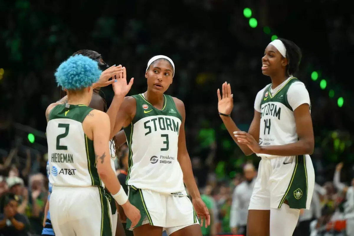 Seattle Storm guard Natisha Hiedeman, forward Taylor Thierry and center Dominique Malonga