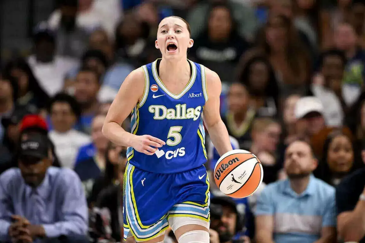 Dallas Wings guard Paige Bueckers brings the ball up court against the Chicago Sky