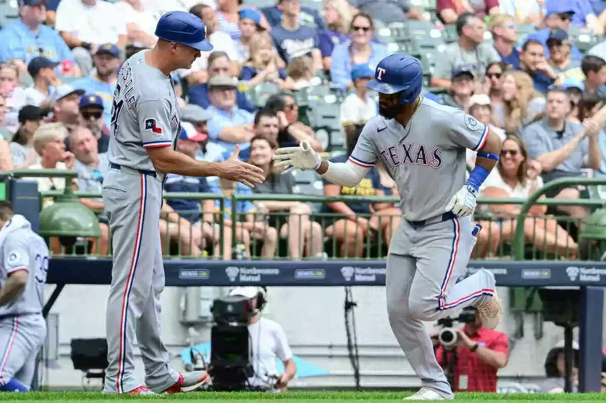 Texas Rangers players celebrate home run