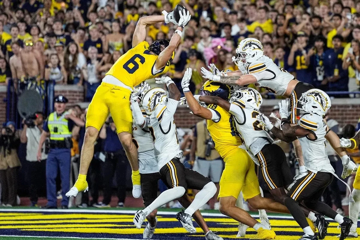 Michigan catches Hail Mary to beat rival Western Michigan