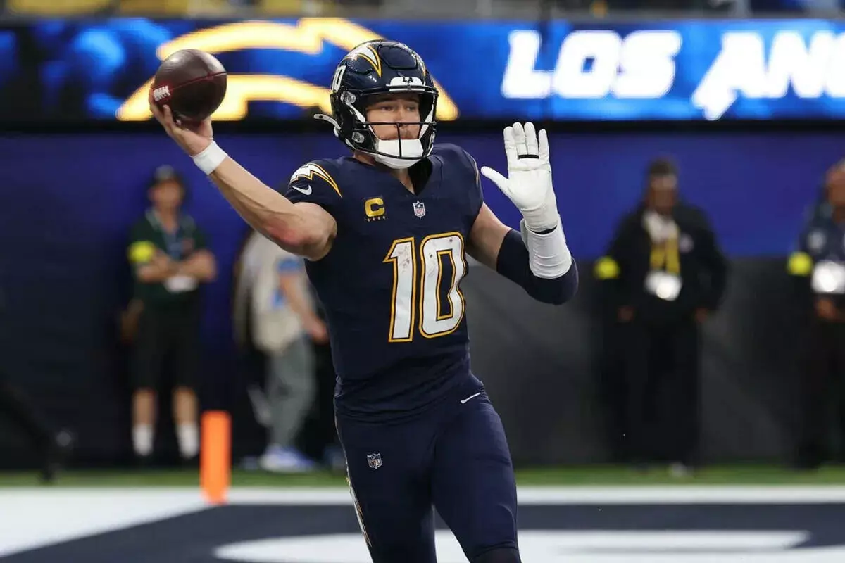 Chargers quarterback Justin Herbert throws a pass