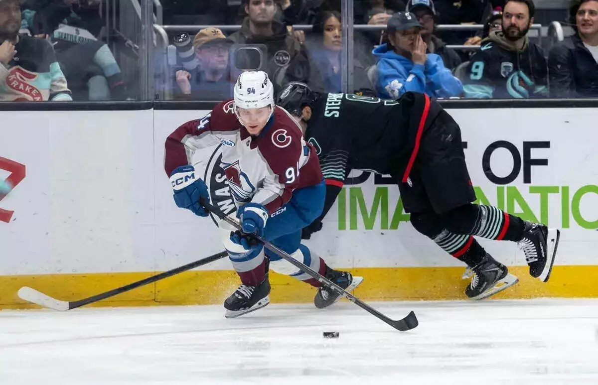 Colorado Avalanche forward Joel Kiviranta skates against Seattle Kraken forward Chandler Stephenson