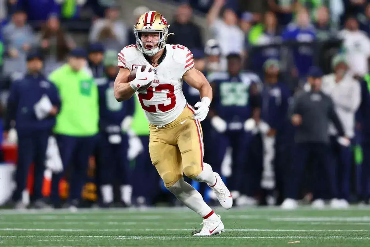 49ers running back Christian McCaffrey runs with the ball
