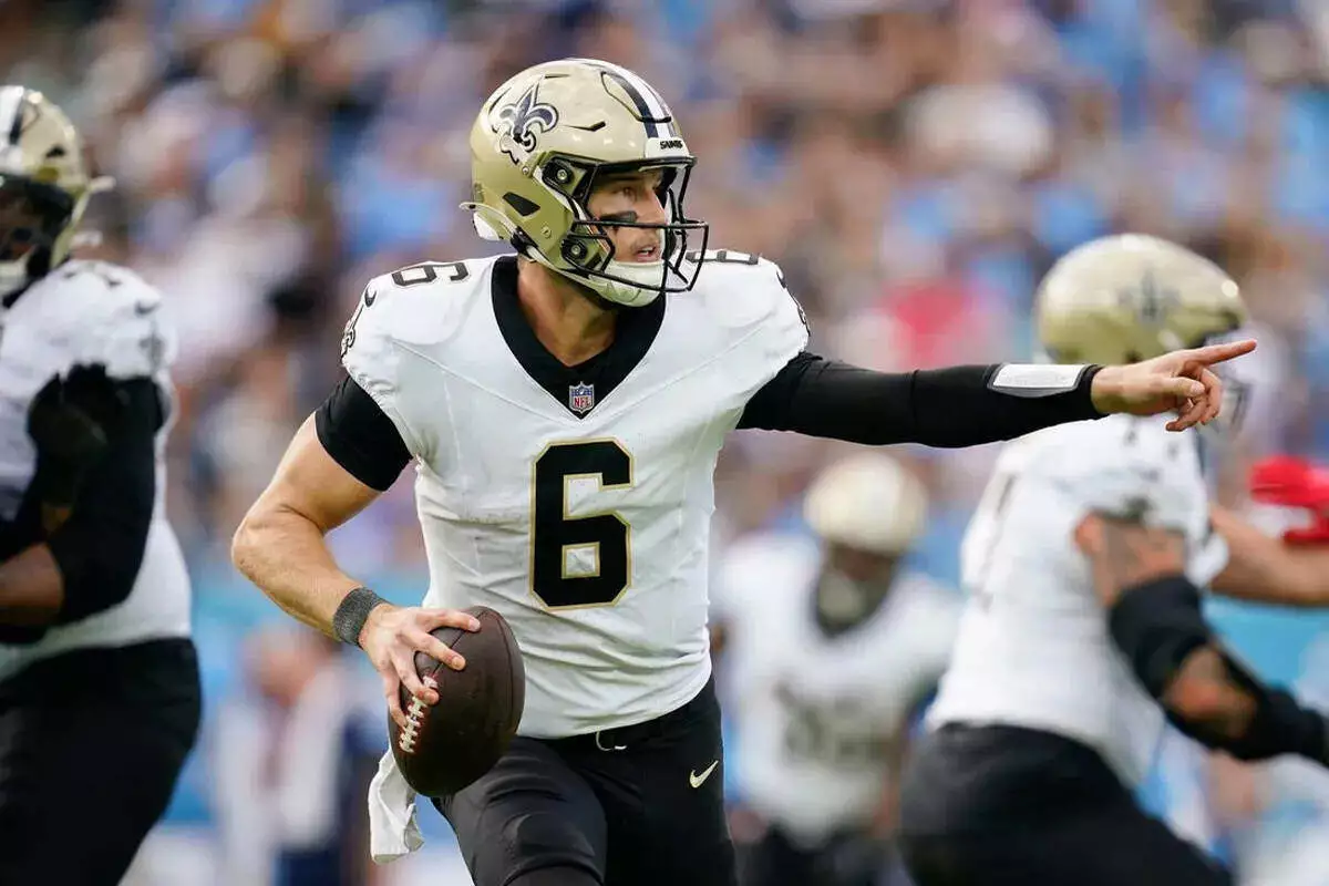 Saints quarterback Tyler Shough looks to pass