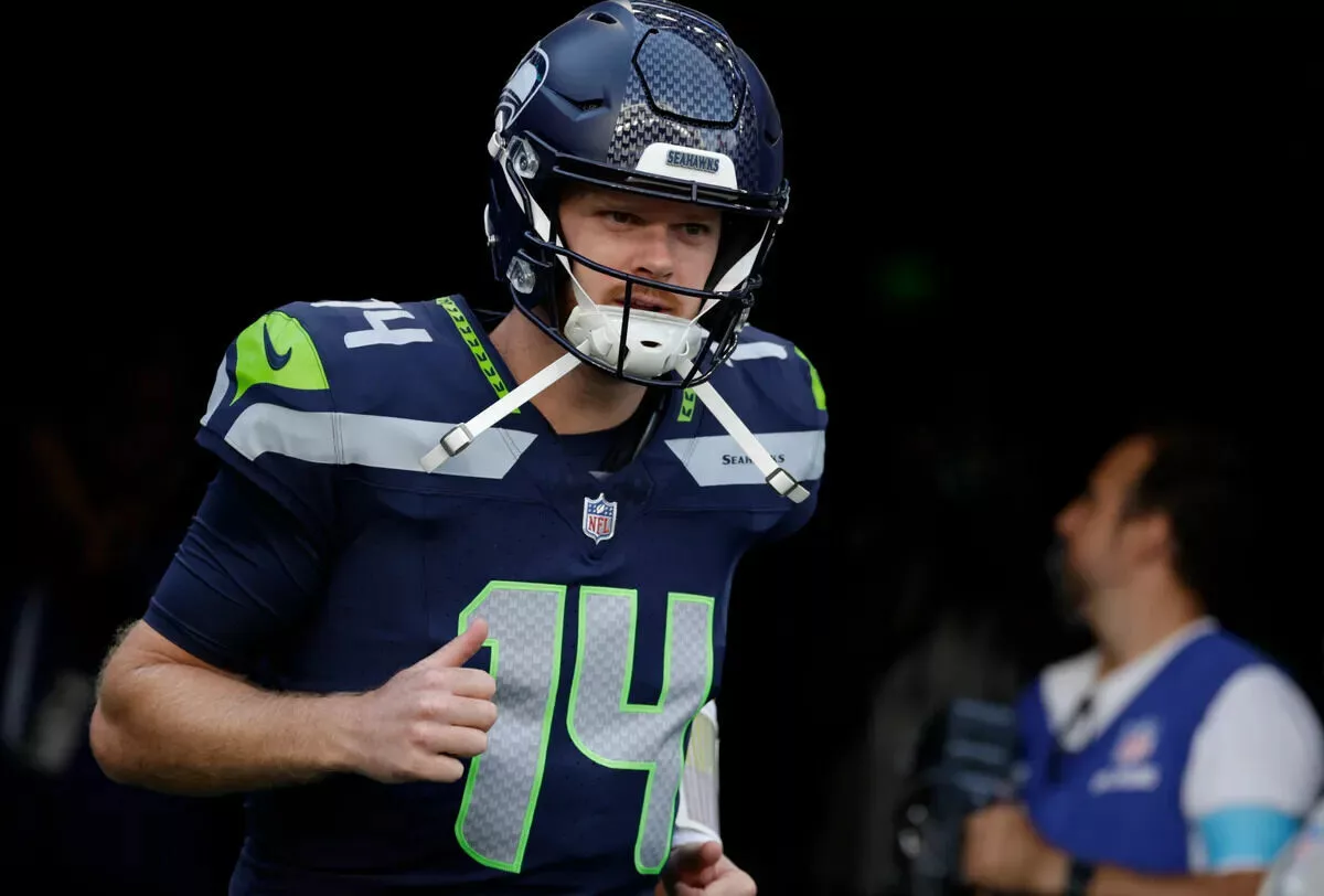 Seahawks quarterback Sam Darnold takes the field