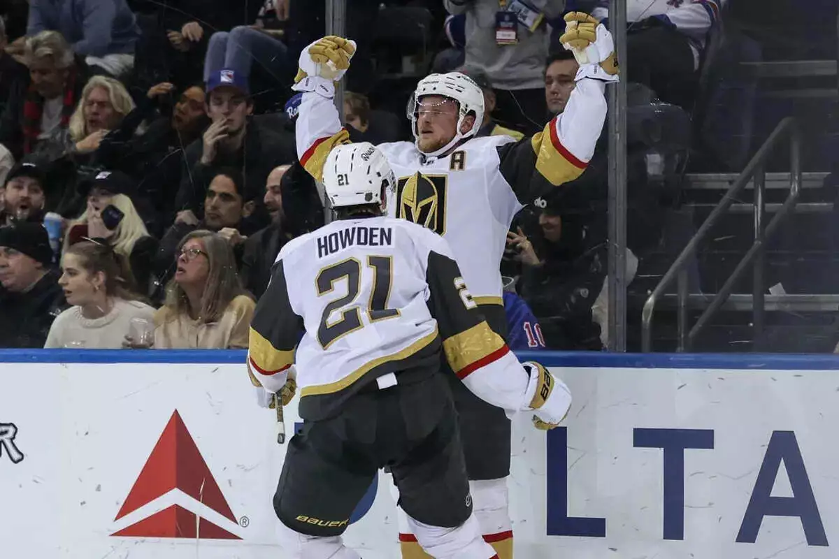 Vegas Golden Knights center Jack Eichel celebrates with center Brett Howden