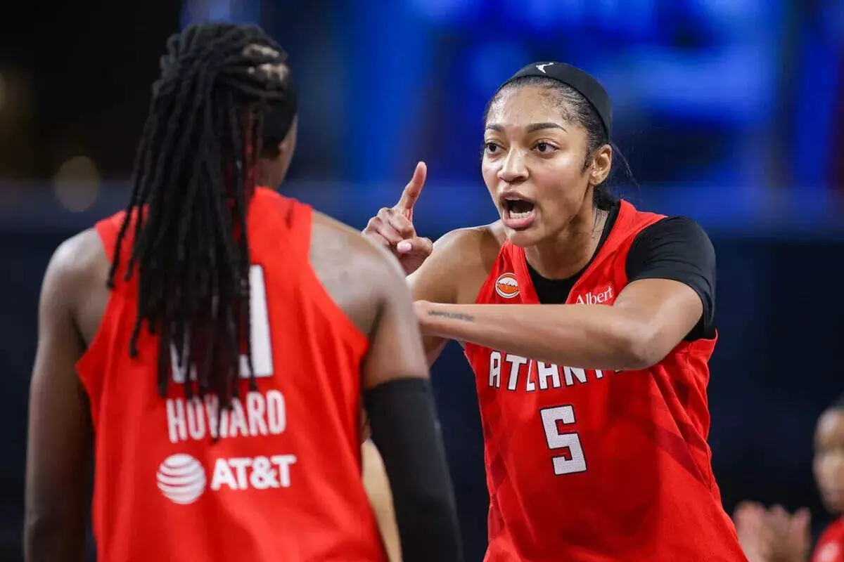 Atlanta Dream forward Angel Reese talks to teammate